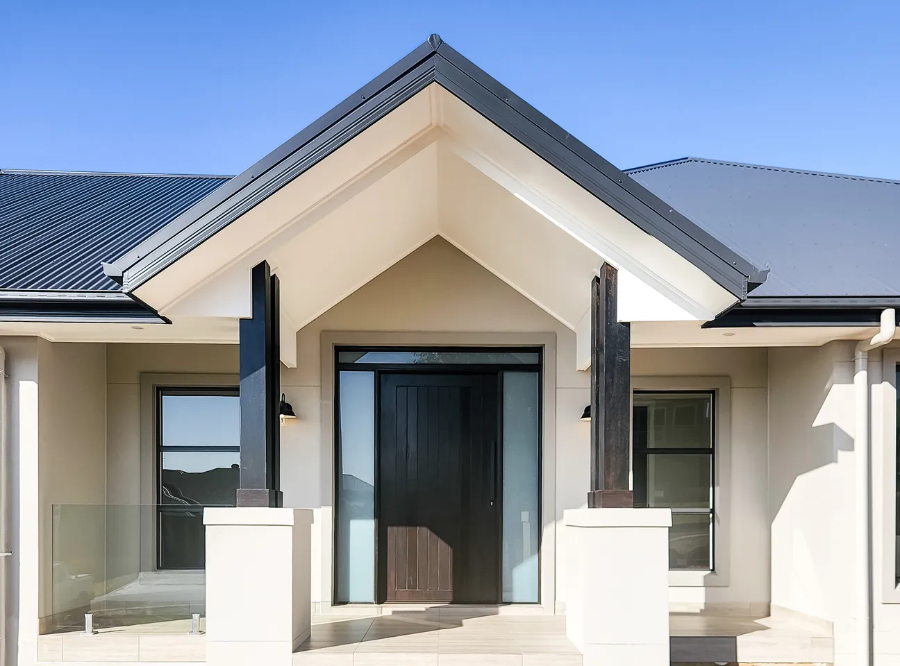 Acreage home facade with portico entry