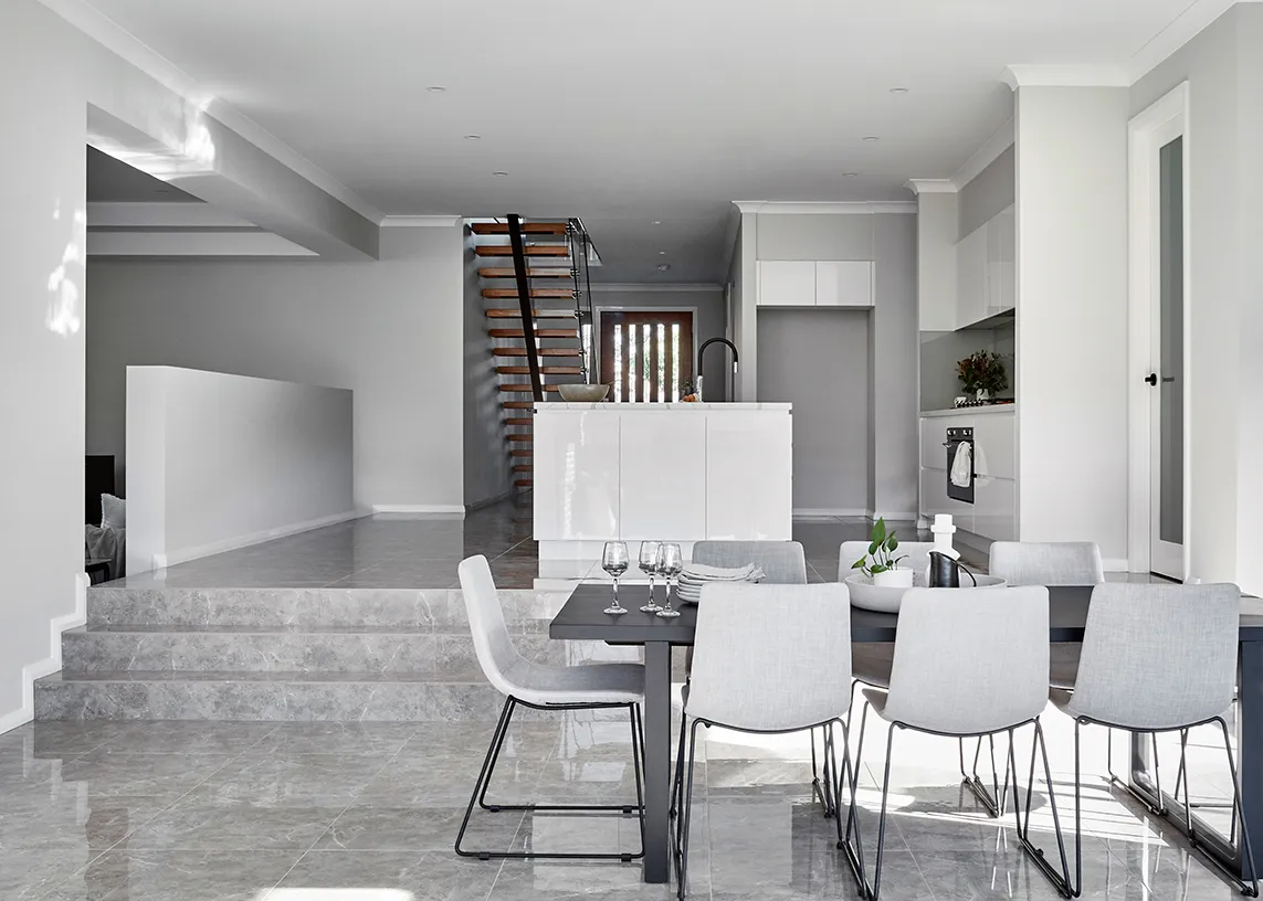 Custom home open-plan kitchen and dining with staircase